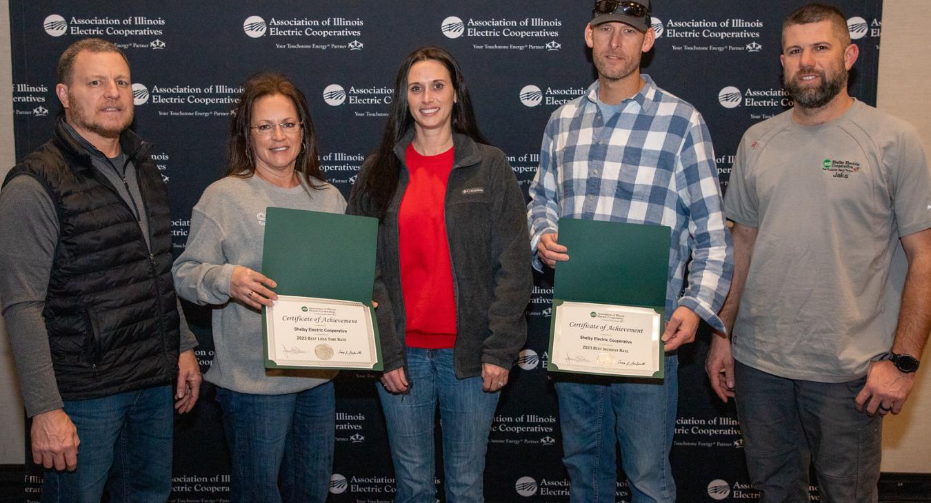 Shelby Electric Cooperative employees with their two safety awards